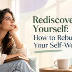Thoughtful woman sitting with a journal in a peaceful setting representing self discovery emotional healing and rebuilding self worth Holistic Living Wellness Studio